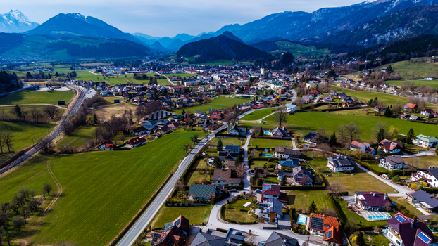 Aerial view of Windischgarsten valley nestled among verdant fields and framed by majestic mountains under a vast sky Windischgarsten Upper Austria Austria. Aerial view of Windischgarsten valley nestled among verdant fields and framed by majestic mountains under a vast sky Windischgarsten Upper Austria Austria.