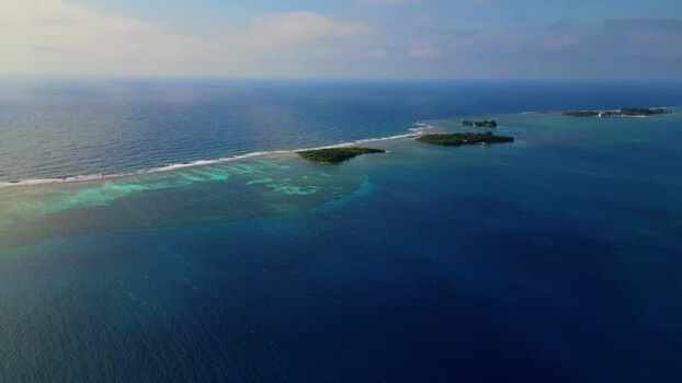 Aerial view of the coral reefs and tropical cays of Guanaja Honduras. Aerial view of the coral reefs and tropical cays of Guanaja Honduras.