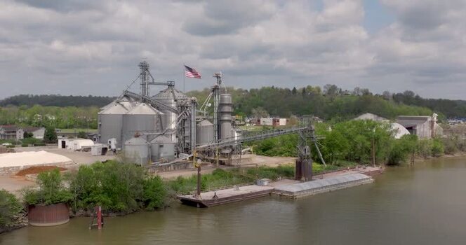 Aerial view of a grain facility on a river United States. Aerial view of a grain facility on a river United States.