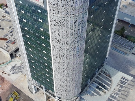 Aerial view of a modern office building with a distinctive perforated facade and glass windows in Sofia Sofia City Province Bulgaria. Aerial view of a modern office building with a distinctive perforated facade and glass windows in Sofia Sofia City Province Bulgaria.