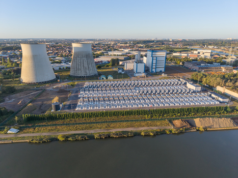 Aerial view of the Cargovil battery energy storage system featuring rows of battery containers cooling towers and industrial infrastructure in Vilvoorde Vlaanderen Belgium. Aerial view of the Cargovil battery energy storage system featuring rows of battery containers cooling towers and industrial infrastructure in Vilvoorde Vlaanderen Belgium.