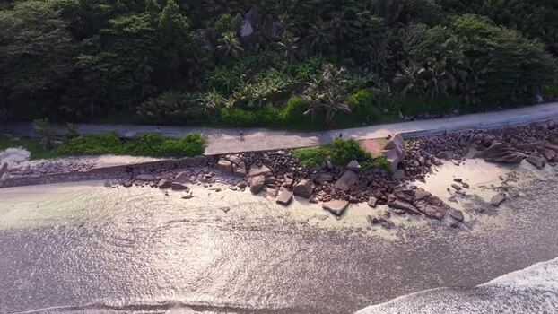 Aerial view of Anse Reunion coastal road Seychelles.