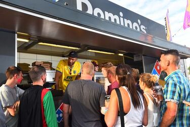 Ex England Goalie David James serves Domino s at the Isle of Wight Festival