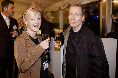 Alesha Dixon fashions a shiny turquoise jacket as she and boyfriend Azuka Ononye support Graduate Fashion Week London