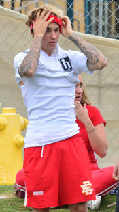Justin Bieber playing football in a park in Playa Del Rey.