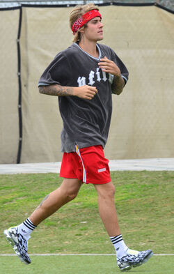 Justin Bieber playing football in a park in Playa Del Rey.