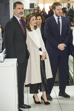 Queen Letizia of Spain fashions Uterq&uuml;e trousers a Hugo Boss shirt and Coollook earrings Madrid