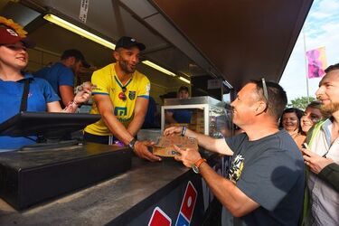 Ex England Goalie David James serves Domino s at the Isle of Wight Festival