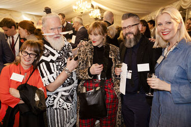 Alesha Dixon fashions a shiny turquoise jacket as she and boyfriend Azuka Ononye support Graduate Fashion Week London