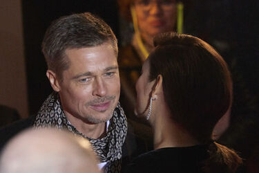 Pregnant Marion Cotillard leans in to speak to Brad Pitt as the pair promote their new film Allied in Madrid Spain