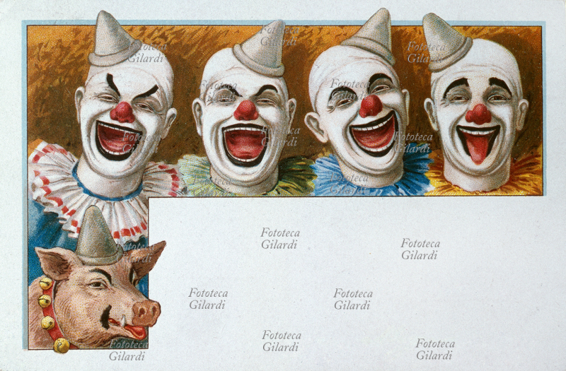 CIRCO quattro clowns bianchi ridono a squarciagola, così come il loro maialino-clown; l\