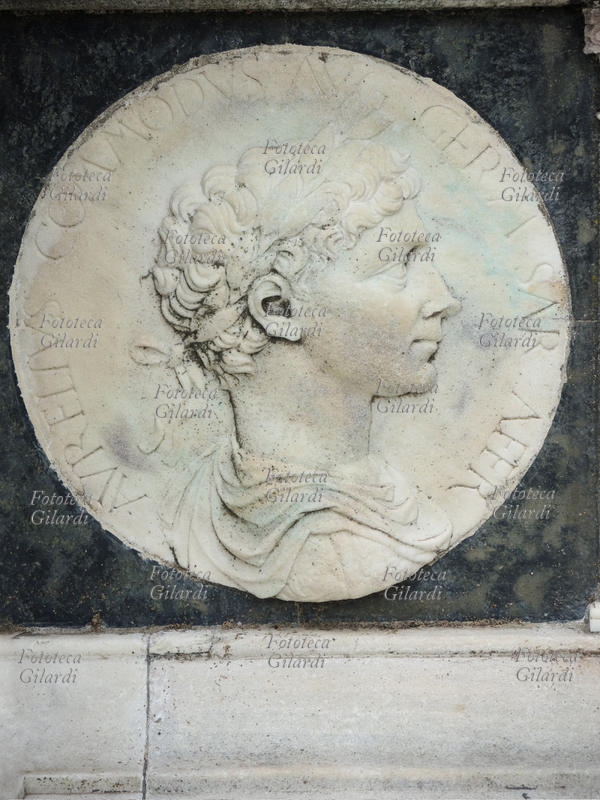 Lucius Elio Aurelio COMMODO (31 August 161 - 31 December 192) Roman emperor from 180 with the name of Cesare Lucio Marcus Aurelius Commodus Antoninus Augustus, member of the Antonini dynasty. Having passed into history with the reputation of an extravagant, cruel and depraved person, he promoted a policy of religious tolerance, interrupting the persecution of Christians; he gave new impetus to the arts and built commemorative monuments of his father Marcus Aurelius. "Aurelius Commodus Aug Germ Sar Sar Affr", decoration in bas-relief from the band depicting famous characters of antiquity and mythological themes, inspired by the medals of the Roman era, carved on the base of the facade of the Basilica of the Certosa di Pavia, a typical example of Lombard Renaissance architecture of the fifteenth century.