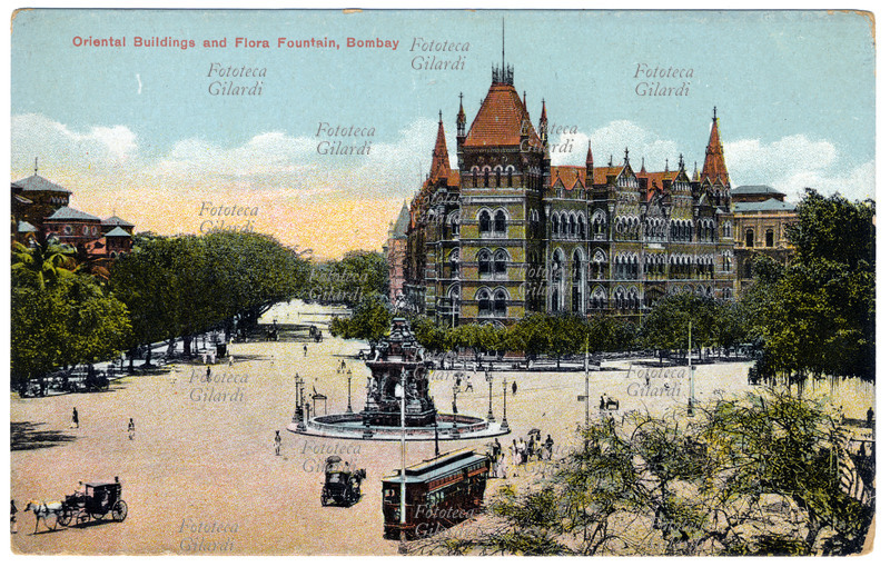 COLONIALISMO Gran Bretagna/India. Bombay, veduta della città, edifici orientali e fontana di Flora. Cromolitografia, 1906 circa.