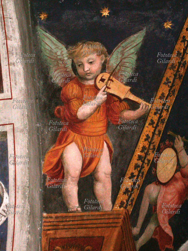 MUSICA Angelo musicante con ribeca. Chiesa di S. Antonio Abate o del SS. Crocifisso. Affresco di Anonimo del XV secolo. Fotografia di Giuliano Grasso, Bormio (SO), 2004.