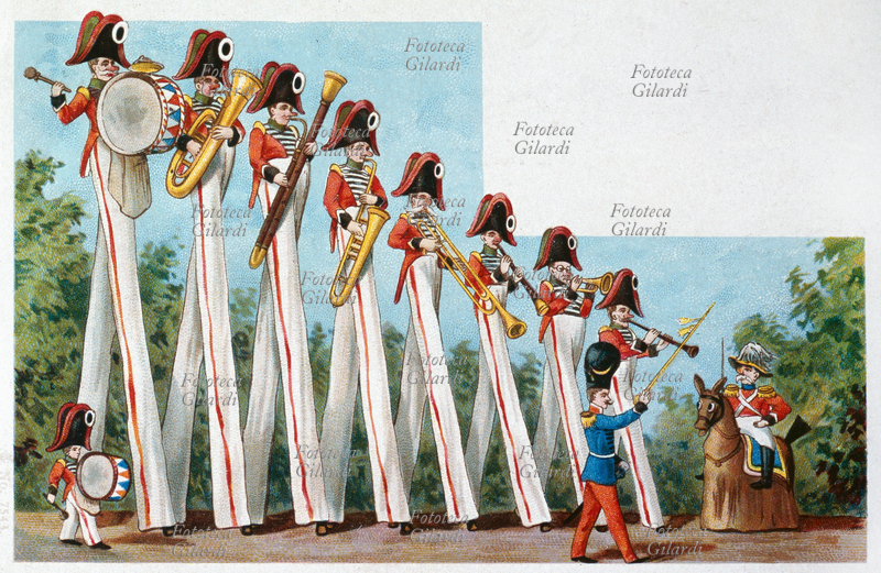 CIRCO musicanti equilibristi, buffa banda musicale marcia sui trampoli. Sono tutti di altezza diversa, disposti in scala, e per aumentare l\