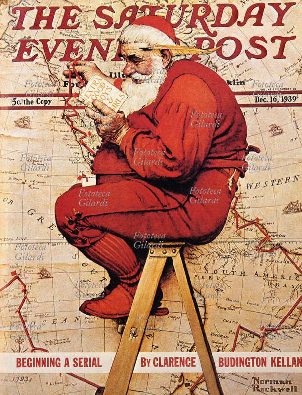 BABBO NATALE consulta il suo libretto con elencati i bimbi più buoni e prepara l\