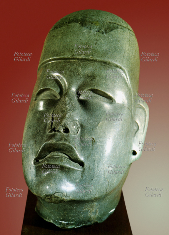 MEXICO Olmec art: head with cap. Jade statue fragment from Tenango del Valle, ca. 850-150 BC