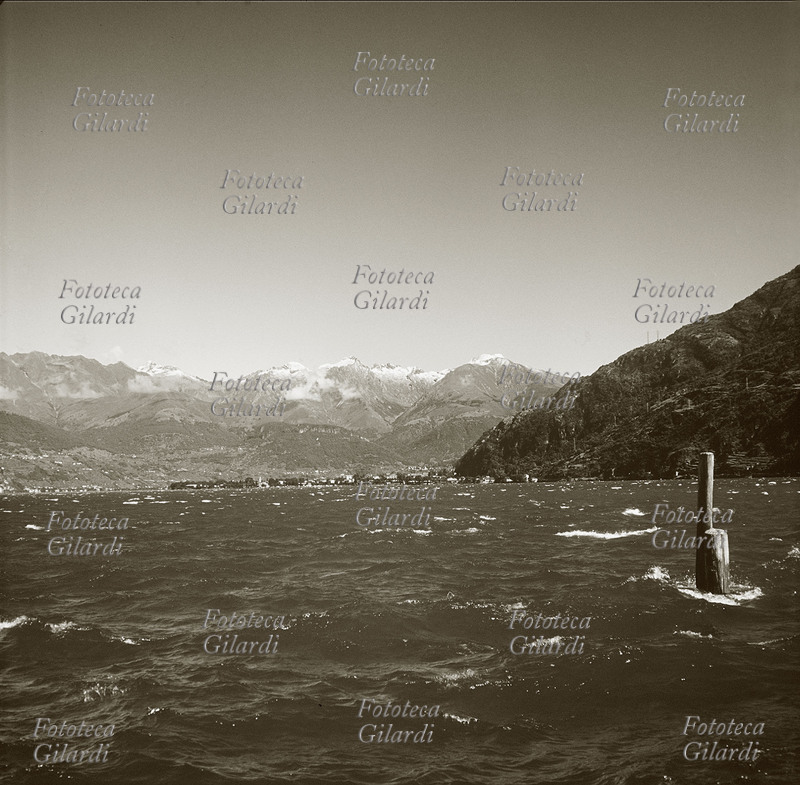Seen LECCO of the citizen from the lake. The places are those described in celeberrimo the manzoniano novel “the promises spouses”. Photographic panorama of the first half of the 20th century.
