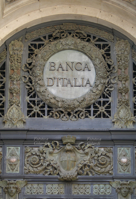 ECONOMIA fregio decorativo sul cancello bronzeo realizzato da Giovanni Lomazzi (5 luglio 1853 – 9 luglio 1925) per l\