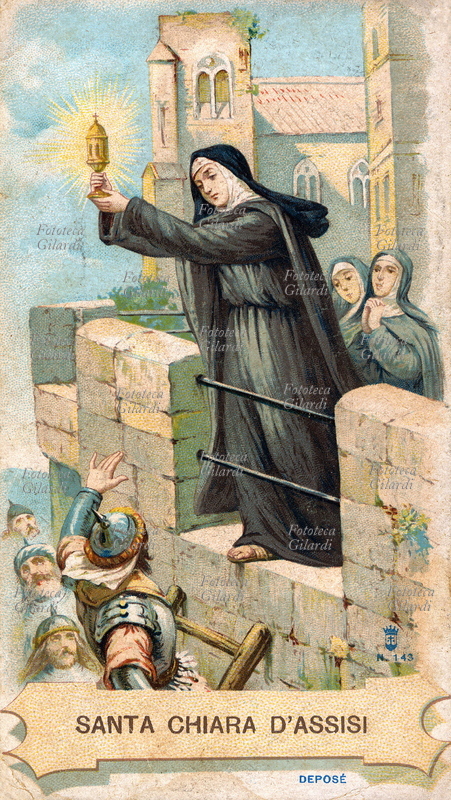 SANTA CHIARA di Assisi (16 luglio 1194 – 11 agosto 1253), al secolo Chiara Scifi, seguace di San Francesco, fondatrice delle Clarisse. Raffigurata mentre respinge i saraceni dal monastero mostrando il calice dell\