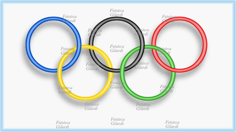 OLYMPICS the rings symbol of the world competition drawn on the Olympic flag on a white background. The 5 intertwined rings, designed by the promoter of the modern Olympic Games Pierre de Coubertin (1 January 1863 – 2 September 1937) represent the 5 continents: blue for Europe, yellow for Asia, black for Africa, green for Oceania, red for America and were for the first time the symbol of the Olympics in Antwerp in 1920. Computer graphics, Italy 2004.