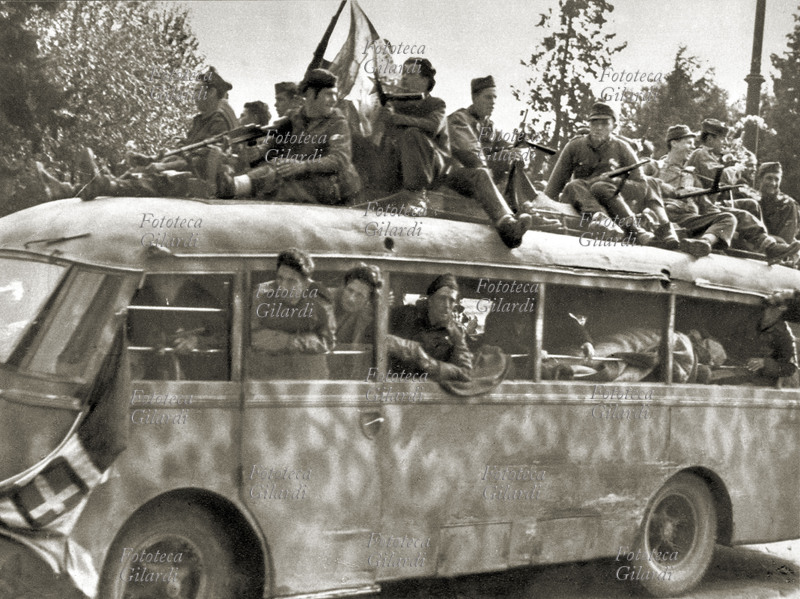II G.M. ITALY 1945 Genoa: partisans arrive on board in city from the courier mountain, in the days of the uprising.