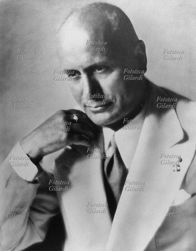 Benito MUSSOLINI (29 July 1883 - 28 April 1945), the Italian dictator in an unusual, pensive attitude: his eyes lowered and the smile on his lips, a hand under his chin. Photographic portrait by Ghitta Carell (September 20, 1899 - January 18, 1972), photographed Hungarian naturalized Italian, official portraitist of the royals of Italy and eminent personalities of the regime, who in the years after the war made portraits to various figures of culture, politics , nobility and Roman bourgeoisie. Rome, 1930-39.