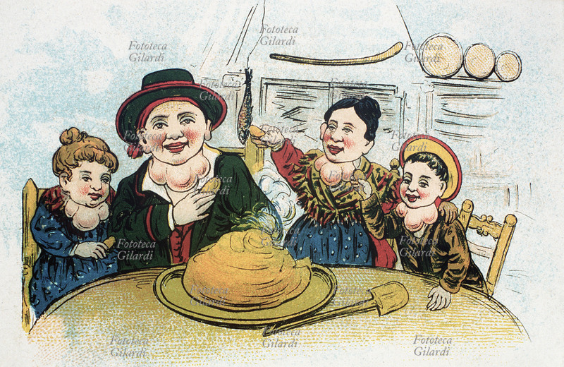 GOZZO La famiglia di Gioppino pranza con la polenta. Al centro della tavola cala dall\