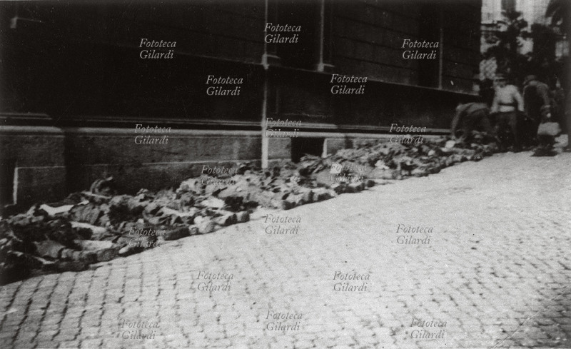 VIA RASELLA the Nazi SS count their dead lined up in Via Rasella after the partisan attack on March 23, 1944. For each of the 32 corpses, 10 civilians will be imprisoned, and finally 335 will be shot at the Ardeatine Caves. Italy, 1944