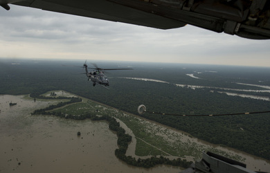 August 30, 2017 - Texas, United States: A HH-60G Pave Hawk from the 106th Rescue Wing prepares to make contact with a refueling drouge attached the wing of a HC-130P/N from the 920th Rescue Wing from Patrick Air Force Base, Fla., over Texas. Hurricane Harvey formed in the Gulf of Mexico and made landfall in southeastern Texas, bringing record flooding and destruction to the region. U.S. military assets supported FEMA as well as state and local authorities in rescue and relief efforts. (Polaris)