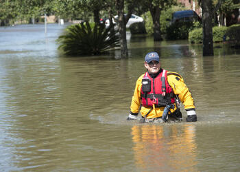 August 30, 2017 - Sugarland, Texas, United States: Rescue Specialist Samuel Hendricks, Texas Task Force 1, wades through a residential area in search of flood victims, due to devastating effects caused by Hurricane Harvey's aftermath. Harvey made landfall into the Texas coast last week as a category 4 hurricane. (Polaris)