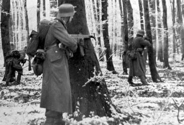 THE STORY of an unsung unit of Second Word War soldiers who stood alongside the infamous ‘Band of Brothers’ as they often fought to the last man to repel Hitler’s last big offensive has been released in a new book detailing their previously little reported struggle. Images show how this unknown band of brothers dug into fox holes in the middle of the snowy Ardennes forest as they wait for the German army to advance, while others see troops stood over the bodies of their fallen comrades. In another picture, a soldier can be seen aiming his rifle at a group of German prisoners, moving them on as they walk with their hands over their heads. The images are from the new book The 110th Holds in the Ardennes by Walter S. Zapotoczny Jr, which tells the tale of how the 110th infantry 28th division held a line through the formidable Ardennes forest against the might of Hitler’s army / Fonthill Media / mediadrumworld.com