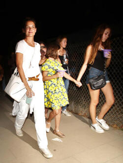 Katie Holmes and Suri Cruise got out to see the sights and taste the delights at the Malibu Fair. Katie went in white, while Suri wore a colorful yellow and green dress, on Sunday, September 3, 2017 X17online.com