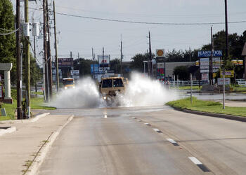 August 30, 2017 - Sugarland, Texas, United States: The Texas Military Department's 36th Sustainment Brigade, comprised of multiple Army National Guardsmen, drive through a flooded residential area in a Light Medium Tactical Vehicle (LMTV) during water rescue operations, due to devastating effects caused by Hurricane Harvey's aftermath. Harvey made landfall into the Texas coast last week as a category 4 hurricane. (Polaris)