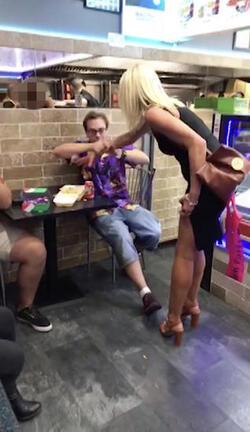 PIC FROM MERCURY PRESS (PICTURED: THE WOMAN THEN ATTEMPTS TO GRAB EWIS CALEYS CHIPS IN A TAKE AWAY IN CLACTON-ON-SEA IN ESSEX) This is the moment a foul-mouthed blonde lady launched herself at a drunken reveller in a shocking takeaway brawl - because he suggested she was in her 60s and threw a chip in her face. Lewis Caley and his friends were getting food from the Quality Diner takeaway in Clacton-on-Sea, Essex, after celebrating his 20th birthday. However an argument ensued when cocky Lewis asked one of the women - estimated to be in her 30s - how old she was and then jokingly suggested she was in her 60s. Footage shows the blonde brand jolly engineer Lewis a c**t and then repeatedly try to snatch his food from him as he sits eating. SEE MERCURY COPY