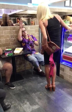 PIC FROM MERCURY PRESS (PICTURED: LEWIS CALEY THROWS THE CHIP AT HER IN A TAKE AWAY IN CLACTON-ON-SEA IN ESSEX) This is the moment a foul-mouthed blonde lady launched herself at a drunken reveller in a shocking takeaway brawl - because he suggested she was in her 60s and threw a chip in her face. Lewis Caley and his friends were getting food from the Quality Diner takeaway in Clacton-on-Sea, Essex, after celebrating his 20th birthday. However an argument ensued when cocky Lewis asked one of the women - estimated to be in her 30s - how old she was and then jokingly suggested she was in her 60s. Footage shows the blonde brand jolly engineer Lewis a c**t and then repeatedly try to snatch his food from him as he sits eating. SEE MERCURY COPY