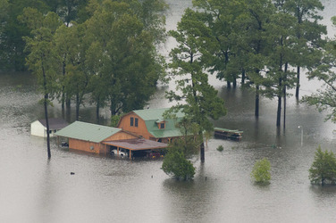 August 2017 - Texas, United States: Hurricane Harvey flooding in Port Arthur, Texas, August 30, 2017. Hurricane Harvey formed in the Gulf of Mexico and made landfall in southeastern Texas, bringing record flooding and destruction to the region. U.S. military assets supported FEMA as well as state and local authorities in rescue and relief efforts. (POLARIS)