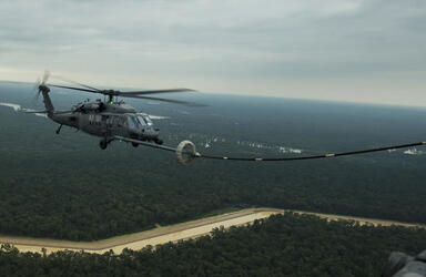 August 30, 2017 - Texas, United States: A HH-60G Pave Hawk from the 106th Rescue Wing receives in-flight fuel from a refueling drouge attached the wing of a HC-130P/N from the 920th Rescue Wing from Patrick Air Force Base, Fla., over Texas. Hurricane Harvey formed in the Gulf of Mexico and made landfall in southeastern Texas, bringing record flooding and destruction to the region. U.S. military assets supported FEMA as well as state and local authorities in rescue and relief efforts. (Polaris)