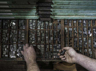 PIC BY SANWAL DEEN / CATERS - (Pictured: Nicolas - Typesetter) - Many hands make light work, and in this photographers unique series, there are many, many of them. Sanwal Deens Work project offers a birds-eye view of the elaborate tasks carried out by people who work with their hands. With just their forearms and hands showing, Sanwals images showcase the work carried out by florists, writers and bakers; pianists, typesetters and cobblers. It is estimated that the average person spends around one third of their life working, and so Sanwal, 27, wanted to show the intricacy of certain professions that can help define someone. -SEE CATERS COPY