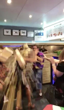 PIC FROM MERCURY PRESS (PICTURED: LEWIS CALEY THROWS CHIPS AND POURS COKE OVER THE BLOND WOMAN IN A TAKE AWAY IN CLACTON-ON-SEA IN ESSEX) This is the moment a foul-mouthed blonde lady launched herself at a drunken reveller in a shocking takeaway brawl - because he suggested she was in her 60s and threw a chip in her face. Lewis Caley and his friends were getting food from the Quality Diner takeaway in Clacton-on-Sea, Essex, after celebrating his 20th birthday. However an argument ensued when cocky Lewis asked one of the women - estimated to be in her 30s - how old she was and then jokingly suggested she was in her 60s. Footage shows the blonde brand jolly engineer Lewis a c**t and then repeatedly try to snatch his food from him as he sits eating. SEE MERCURY COPY