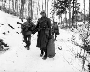 THE STORY of an unsung unit of Second Word War soldiers who stood alongside the infamous ‘Band of Brothers’ as they often fought to the last man to repel Hitler’s last big offensive has been released in a new book detailing their previously little reported struggle. Images show how this unknown band of brothers dug into fox holes in the middle of the snowy Ardennes forest as they wait for the German army to advance, while others see troops stood over the bodies of their fallen comrades. In another picture, a soldier can be seen aiming his rifle at a group of German prisoners, moving them on as they walk with their hands over their heads. The images are from the new book The 110th Holds in the Ardennes by Walter S. Zapotoczny Jr, which tells the tale of how the 110th infantry 28th division held a line through the formidable Ardennes forest against the might of Hitler’s army / Fonthill Media / mediadrumworld.com