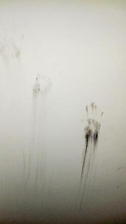 PIC FROM MERCURY PRESS. (PICTURED: THE GHOSTLY HANDPRINTS ON JOANNE GALLAGHERS WALLS.) A mum-of-three claims her home is being haunted by a child ghost named Benny who even left creepy black handprints on her daughters bedroom wall - after a young man hanged himself in the house. Joanne Gallagher was in her eight-year-old daughter Aimees room cleaning while she was on holiday two weeks ago when she spotted the black dusty hand marks on the wall. The 39-year-old claims it could not have been her daughter as she was on holiday at the time and instead believes it could be Benny, who tried to communicate with the family on numerous occasions.