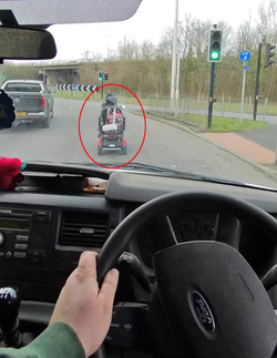 VIDEO Lorry driver stunned after getting stuck behind mobility scooter going just 10mph on busy road VIDEO Lorry driver stunned after getting stuck behind mobility scooter going just 10mph on busy road
