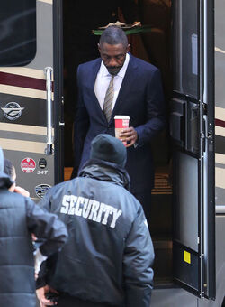 Idris Elba wears a Navy Blue Pinstriped Suit on set of Molly s Game in Toronto
