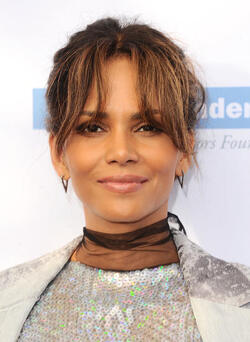 Pregnant at 50 Halle Berry cradles apparent baby bump at the Butterfly Ball
