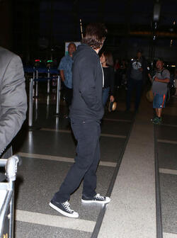 The enigmatic Joaquin Phoenix sports a scruffy beard zip up hoodie and shades as he spends National Brother s Day catching a flight with his lovely sister Summer.