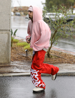 Disheveled Justin Bieber goes go karting in the rain