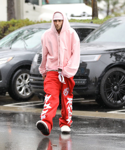 Disheveled Justin Bieber goes go karting in the rain