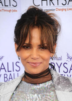 Pregnant at 50 Halle Berry cradles apparent baby bump at the Butterfly Ball