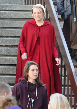 EXCLUSIVE Elisabeth Moss in Costume as Offred in The Handmaid s Tale Filming in Toronto.